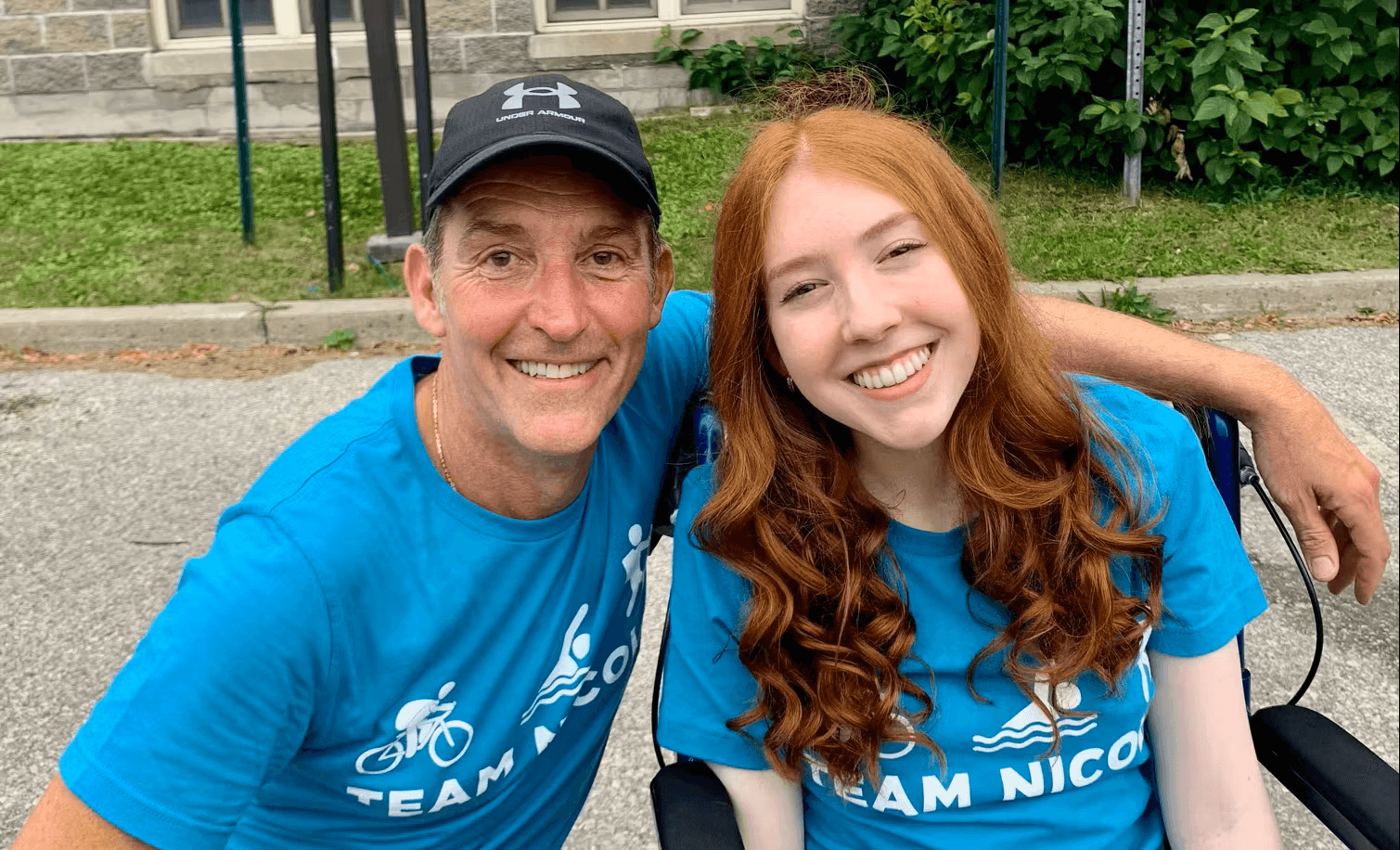 Two proud Change Makers, arm in arm, smiling.