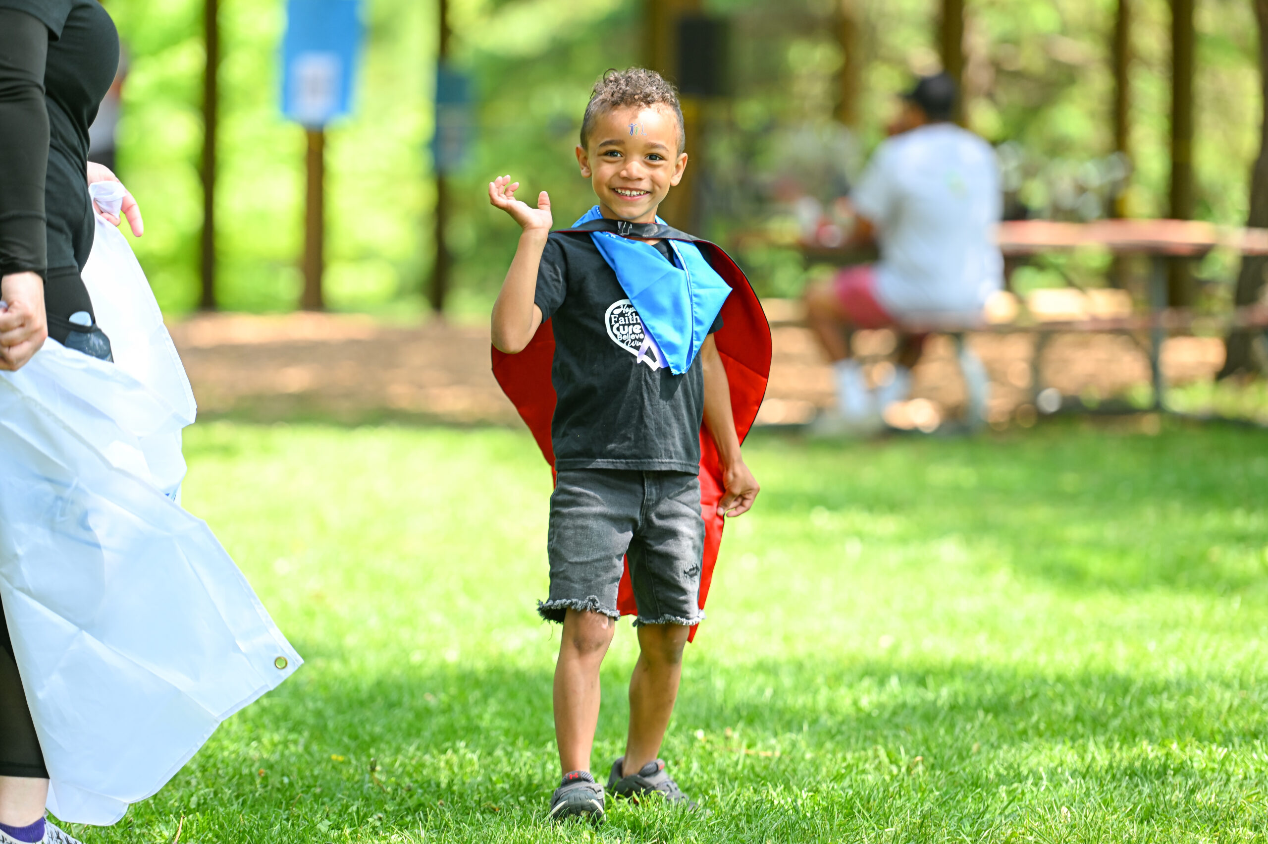A little boy wearing his Walk to Make Cystic Fibrosis History t-shirt.